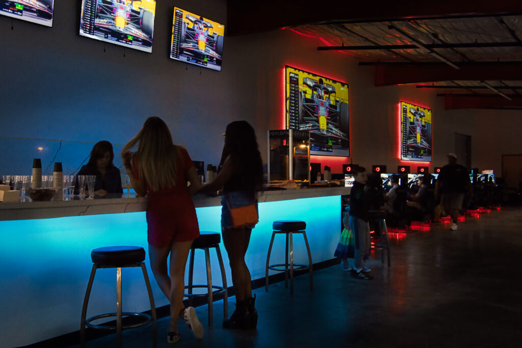 Two Ladies getting drinks at the upstairs bar in the event space of the Asylum